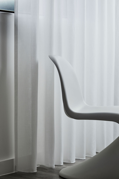 White sheer curtains at a window